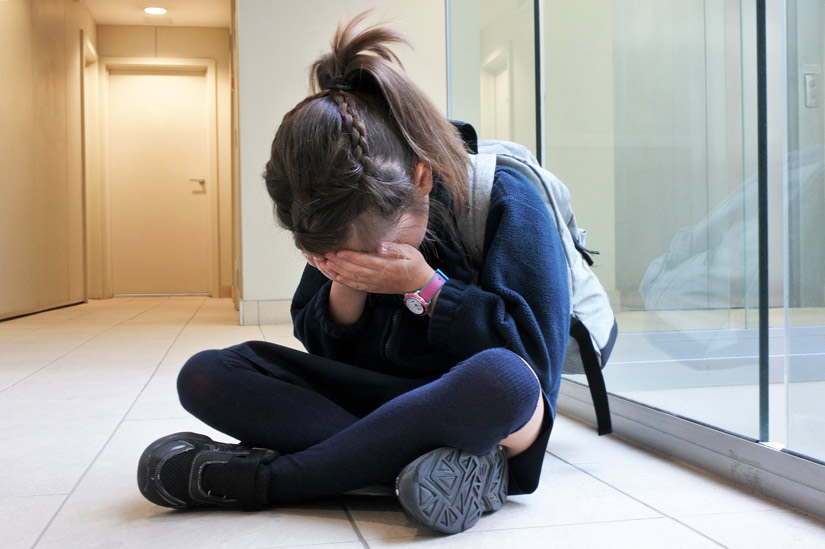 school girl crying - traumatic
