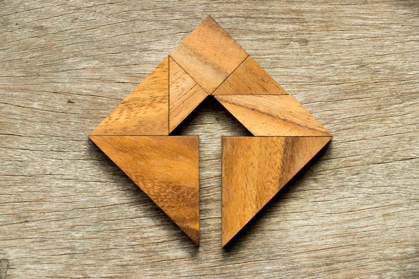 wooden puzzle creating shape of arrow - trauma-responsive