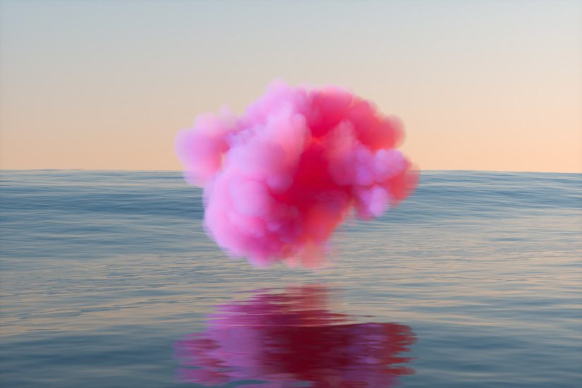 bright pink cloud hovering over ocean or lake water - the pink cloud