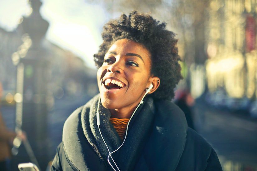 woman listening to music headphones happy recovery